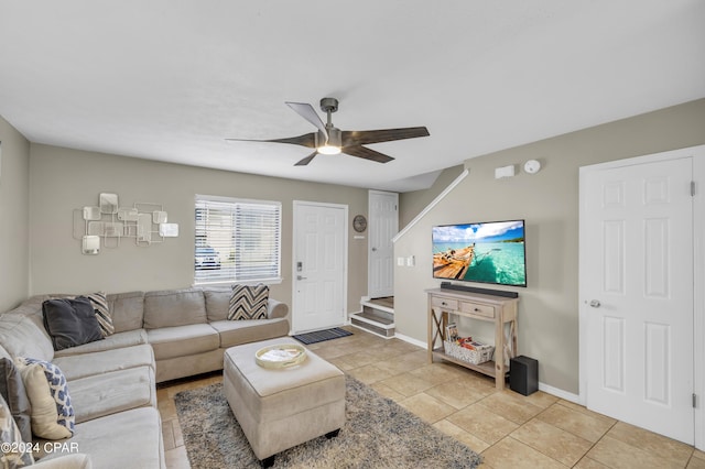 living room with ceiling fan and light tile patterned floors