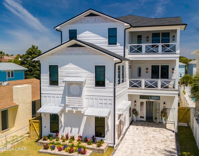 view of front of house featuring a balcony