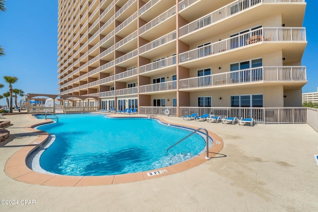 view of pool featuring a patio area