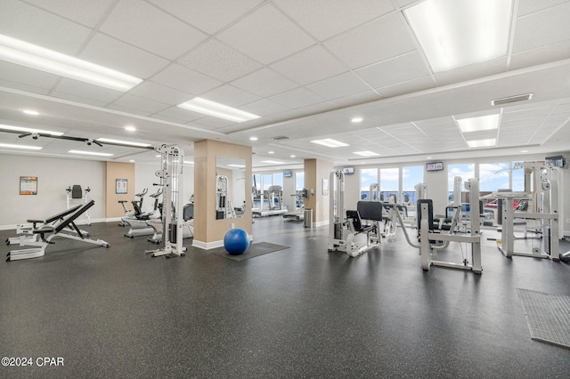 workout area featuring a paneled ceiling