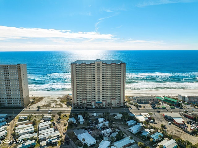 bird's eye view with a water view and a view of the beach