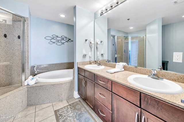 bathroom featuring shower with separate bathtub, double sink vanity, and tile patterned flooring