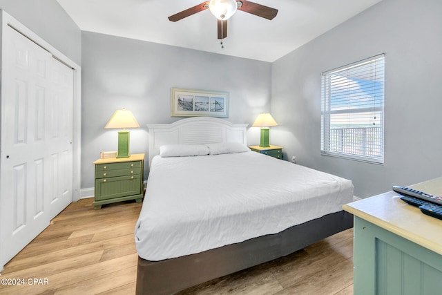 bedroom featuring a closet, a ceiling fan, and light wood-style floors