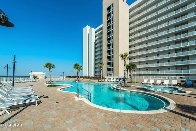 community pool featuring a patio