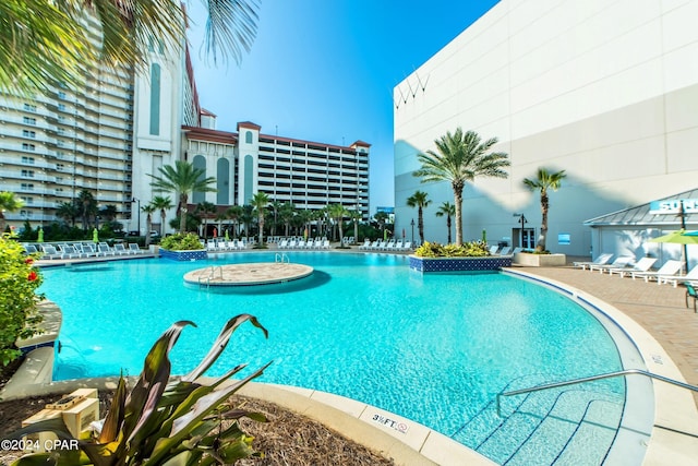 community pool with a patio