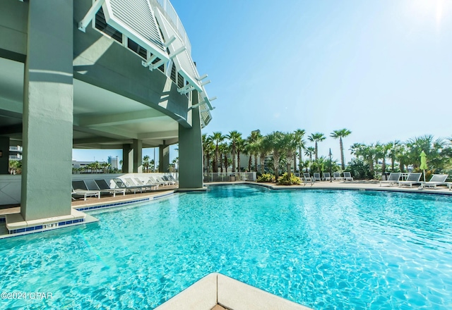 community pool with a patio area