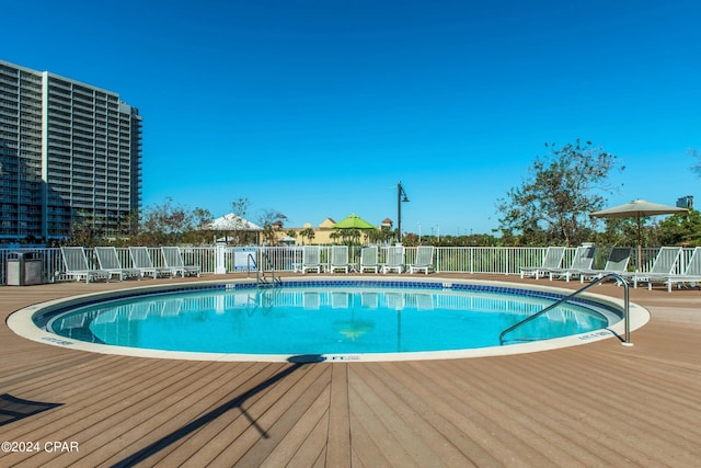 community pool featuring fence