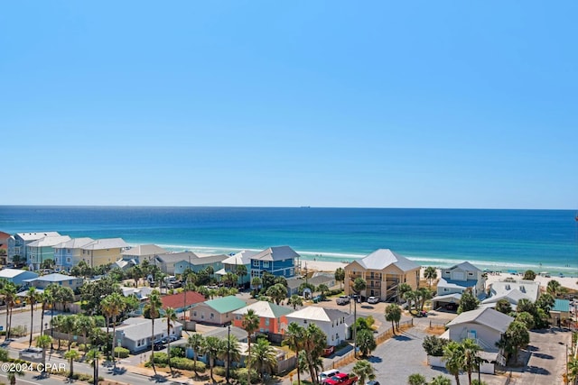 drone / aerial view with a residential view and a water view