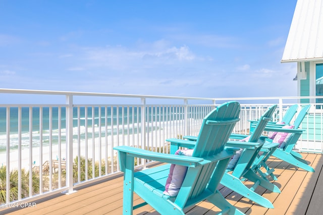 wooden deck featuring a water view