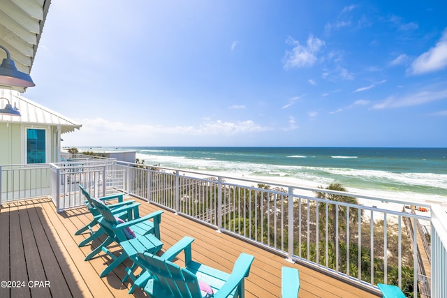 wooden deck with a water view