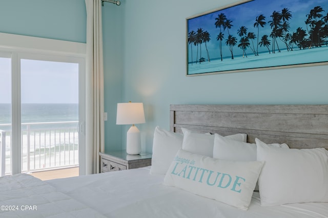 bedroom featuring a water view