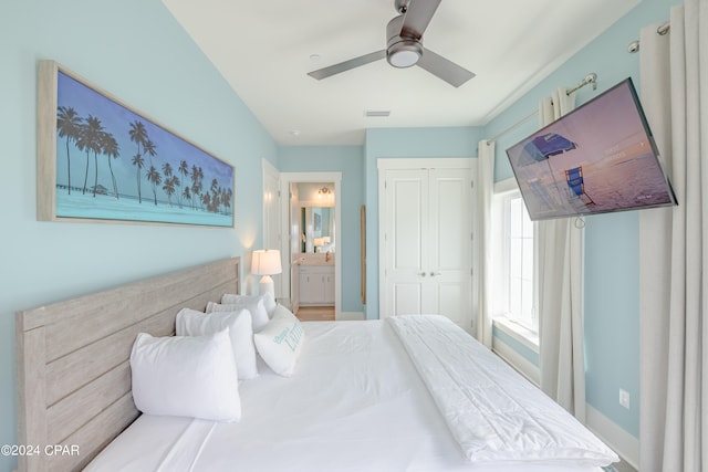 bedroom featuring a closet, ceiling fan, and ensuite bath