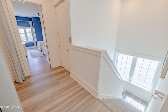 hallway with light wood-type flooring