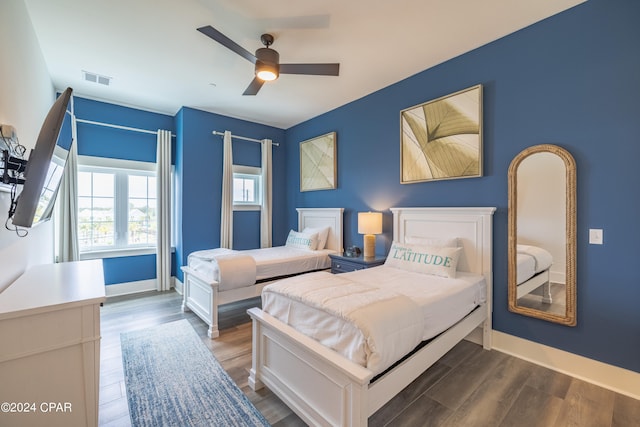 bedroom featuring hardwood / wood-style floors and ceiling fan