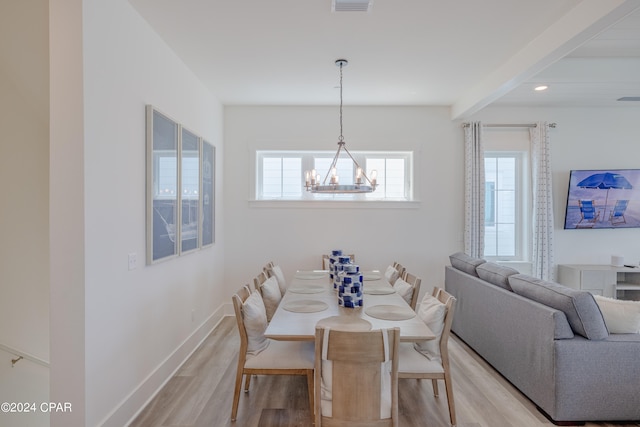 dining room with a notable chandelier and hardwood / wood-style flooring