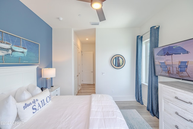 bedroom featuring ceiling fan and light wood-type flooring