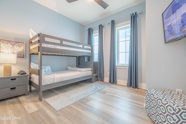 bedroom featuring light hardwood / wood-style floors and ceiling fan