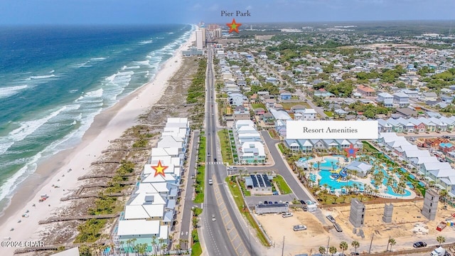 aerial view with a water view and a view of the beach