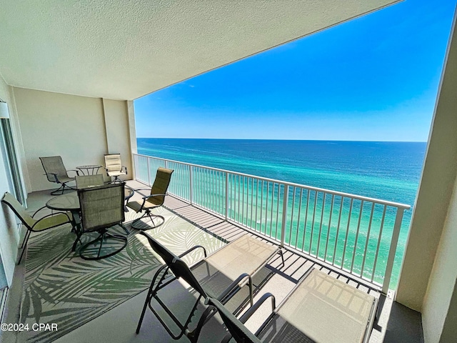 balcony featuring a water view