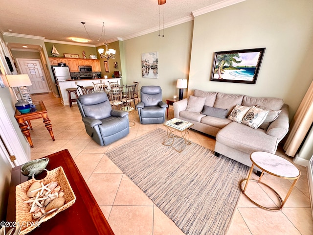 living room with a textured ceiling, tile floors, an inviting chandelier, and crown molding