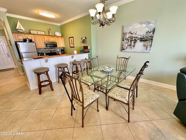 dining area featuring a textured ceiling, crown molding, an inviting chandelier, and light tile floors