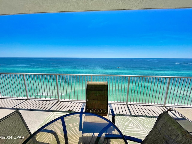 balcony featuring a water view