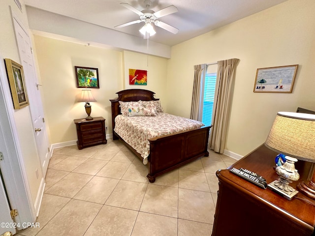 tiled bedroom with ceiling fan