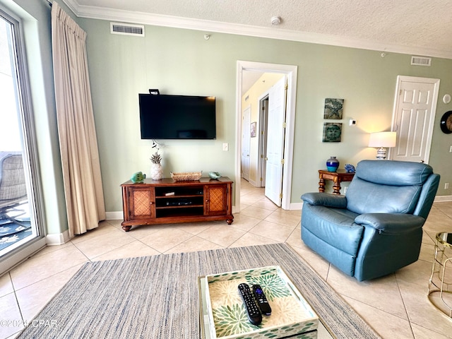 tiled living room with a textured ceiling and crown molding