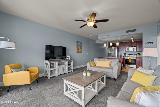 carpeted living area featuring ceiling fan, visible vents, and baseboards