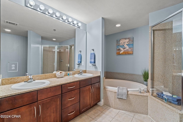 full bath with double vanity, a sink, visible vents, and a shower stall