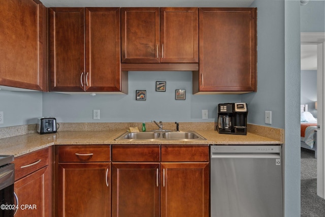 kitchen with a sink, light countertops, and stainless steel dishwasher