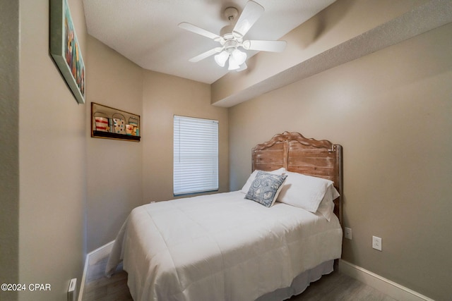 bedroom with hardwood / wood-style flooring and ceiling fan