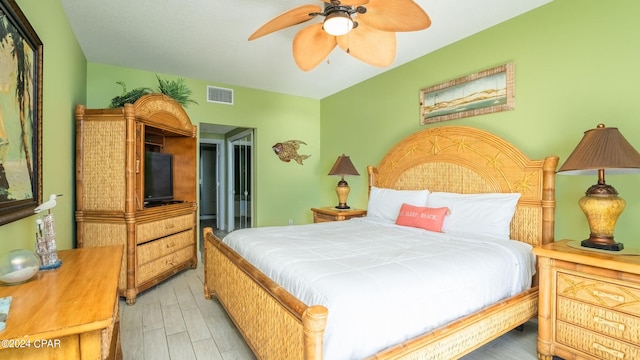 bedroom featuring hardwood / wood-style flooring and ceiling fan