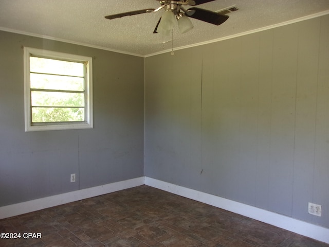 unfurnished room with ceiling fan and a textured ceiling