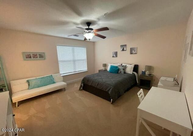 carpeted bedroom featuring ceiling fan