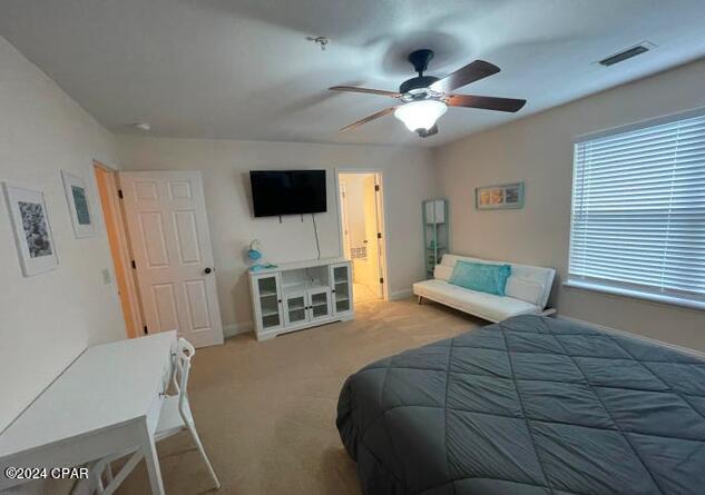 carpeted bedroom with ceiling fan