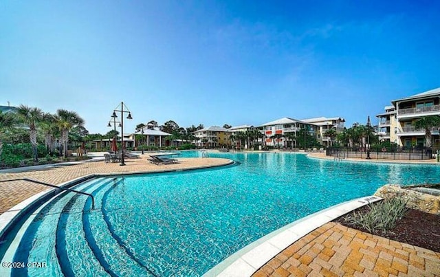 view of swimming pool featuring a patio area