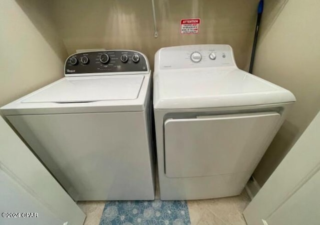 laundry room featuring washing machine and clothes dryer