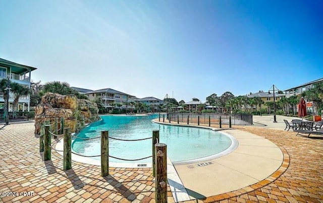 view of pool featuring a patio area