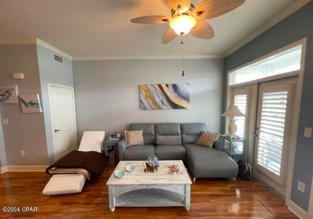 living room featuring ceiling fan, dark wood-type flooring, and ornamental molding