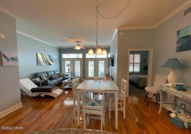 dining area featuring french doors, hardwood / wood-style floors, ceiling fan, a wealth of natural light, and crown molding