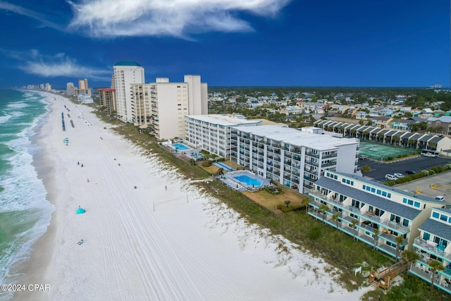 drone / aerial view featuring a view of the beach and a water view