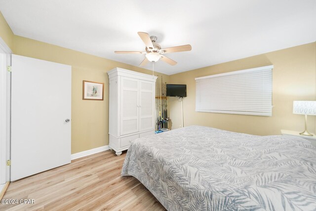 bedroom featuring ceiling fan and light hardwood / wood-style flooring