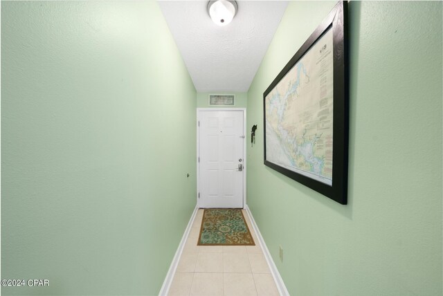 entryway with a textured ceiling