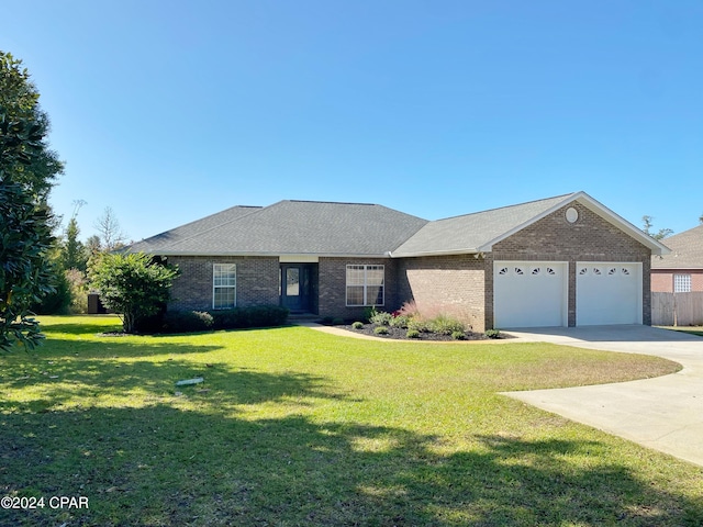 ranch-style home featuring a garage and a front lawn