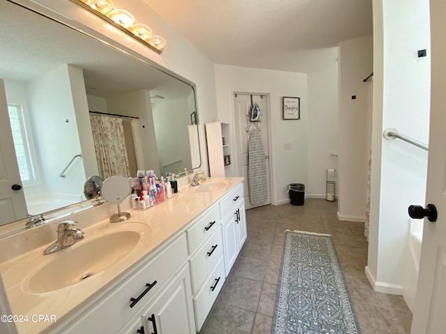 bathroom with vanity and tile patterned floors