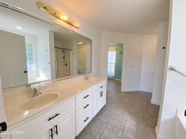 bathroom with vanity, tile patterned flooring, and plus walk in shower