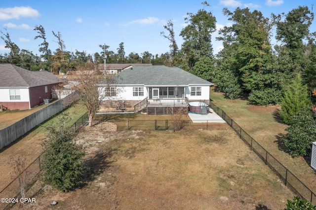 back of house featuring a yard