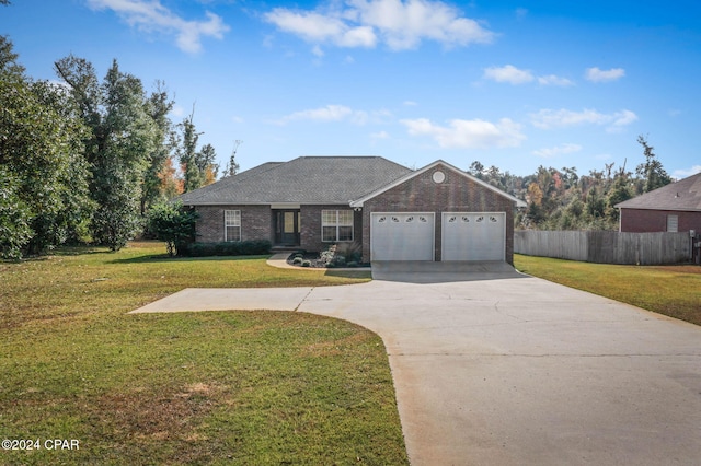 ranch-style home featuring a garage and a front yard