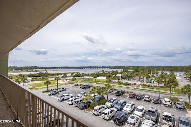 balcony featuring a water view